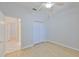 Bright bedroom featuring light wood floors, closet, and ceiling fan at 4627 56Th E Dr, Bradenton, FL 34203