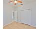 Cozy bedroom with hardwood floors, ceiling fan, closet for storage, and an ensuite bathroom at 4627 56Th E Dr, Bradenton, FL 34203