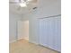 Bright bedroom with wood floors, a ceiling fan, large closet, and an ensuite bathroom at 4627 56Th E Dr, Bradenton, FL 34203