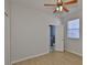 Well-lit bedroom featuring wood floors, a ceiling fan, and access to the bathroom at 4627 56Th E Dr, Bradenton, FL 34203