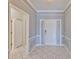 Foyer features tile flooring, neutral walls, trim accents, and a white front door at 4627 56Th E Dr, Bradenton, FL 34203