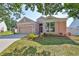 Inviting home featuring a lovely landscaped yard, a two-car garage, and a screened entrance at 4627 56Th E Dr, Bradenton, FL 34203