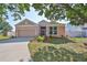 Charming single-story home with a well-manicured lawn, mature trees, and a two-car garage at 4627 56Th E Dr, Bradenton, FL 34203