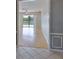 Bright living room with wood floors and sliding glass doors overlooking the pool at 4627 56Th E Dr, Bradenton, FL 34203