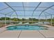 Screen-enclosed pool overlooking tranquil pond, perfect for relaxing and enjoying the outdoors at 4627 56Th E Dr, Bradenton, FL 34203