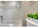 The bathroom has tiled walls with a mosaic accent at 4812 Greywood Ln, Sarasota, FL 34235