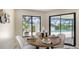 Cozy dining area with a view of the pool and landscaped backyard at 4812 Greywood Ln, Sarasota, FL 34235