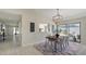 Cozy dining room with a view to the kitchen and access to the backyard at 4812 Greywood Ln, Sarasota, FL 34235