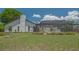 The well-maintained lawn leads up to a screened-in pool at 4812 Greywood Ln, Sarasota, FL 34235