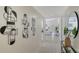 Long hallway with decorative wall art leading into the living room at 4812 Greywood Ln, Sarasota, FL 34235