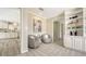 Neutral hallway leading to the living areas, featuring tile flooring and access to other rooms at 4812 Greywood Ln, Sarasota, FL 34235