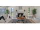 Bright living room featuring a tiled fireplace, modern decor, and ample natural light at 4812 Greywood Ln, Sarasota, FL 34235