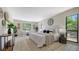 Spacious main bedroom featuring modern decor, two sitting chairs, and lots of natural light at 4812 Greywood Ln, Sarasota, FL 34235