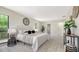 The main bedroom featuring modern decor, accent lighting, and entry to the en suite bathroom at 4812 Greywood Ln, Sarasota, FL 34235