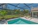 The screened-in pool has a beautiful view of the lush greenery at 4812 Greywood Ln, Sarasota, FL 34235