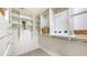 Spacious walk-in closet featuring custom shelving and ample storage space at 4812 Greywood Ln, Sarasota, FL 34235