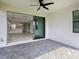 Back patio with large sliding glass doors looking into home interior with stylish flooring at 4927 Carova Way, Bradenton, FL 34211