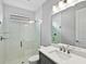 Modern bathroom with glass enclosed shower and vanity with stainless steel fixtures at 4927 Carova Way, Bradenton, FL 34211