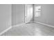 Bedroom featuring tiled floor, a window for natural light, and neutral wall color at 4927 Carova Way, Bradenton, FL 34211