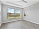 Bedroom features a large window that offers natural light and a view of the outdoors at 4927 Carova Way, Bradenton, FL 34211