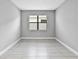Neutral bedroom featuring tile floors, a single window, and fresh, neutral paint at 4927 Carova Way, Bradenton, FL 34211