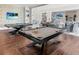 Community billiards room featuring 2 pool tables, TVs, and comfortable seating for socializing at 4927 Carova Way, Bradenton, FL 34211