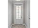 Elegant entryway with a decorative front door, neutral paint, and tiled flooring at 4927 Carova Way, Bradenton, FL 34211