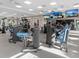 Spacious fitness center featuring various workout stations, machines, and mounted TVs at 4927 Carova Way, Bradenton, FL 34211