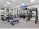 Fully-equipped fitness center with weight machines, exercise equipment, and large mirrors at 4927 Carova Way, Bradenton, FL 34211