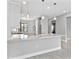 Kitchen with a marble-topped island, stainless steel faucet, and pendant lighting at 4927 Carova Way, Bradenton, FL 34211