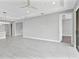 Spacious living area features tile floors, recessed lights, a ceiling fan, and seamless access to other rooms at 4927 Carova Way, Bradenton, FL 34211