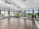 Bright yoga studio featuring hardwood floors, large windows, and exercise equipment at 4927 Carova Way, Bradenton, FL 34211