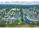 Aerial view of homes in a residential area with pond views and well-maintained landscaping at 5561 Burnt Branch Cir, Sarasota, FL 34232