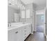 Bright bathroom with dual vanity, modern fixtures, and gray walls at 5561 Burnt Branch Cir, Sarasota, FL 34232