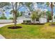 Two-story home with a well-manicured lawn and a two car garage at 5561 Burnt Branch Cir, Sarasota, FL 34232