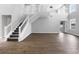 Bright living room featuring hard floors, staircase, and plenty of natural light at 5561 Burnt Branch Cir, Sarasota, FL 34232