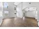Large living area with abundant natural light, sleek flooring, and an open layout, ideal for entertaining at 5561 Burnt Branch Cir, Sarasota, FL 34232