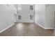 Spacious living area featuring beautiful flooring, abundant natural light, and a clean, modern aesthetic at 5561 Burnt Branch Cir, Sarasota, FL 34232