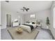 Stylish main bedroom with ceiling fan, neutral walls, and decorative accents at 5561 Burnt Branch Cir, Sarasota, FL 34232