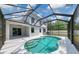 Inviting screened-in pool area, perfect for relaxation and entertainment with an attached covered patio at 5561 Burnt Branch Cir, Sarasota, FL 34232