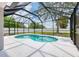 Serene screened-in pool offering a private outdoor retreat with landscaped surroundings and clear blue water at 5561 Burnt Branch Cir, Sarasota, FL 34232