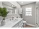 Bright bathroom featuring a single sink vanity and tiled shower at 5750 Carriage Dr, Sarasota, FL 34243