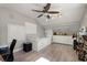 This bedroom boasts vaulted ceilings, laminate floors and a ceiling fan with ample room to relax at 5750 Carriage Dr, Sarasota, FL 34243