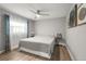 Comfortable bedroom with a ceiling fan and natural light at 5750 Carriage Dr, Sarasota, FL 34243
