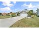Well-maintained single-story home featuring fresh landscaping, a driveway and a two car garage at 5750 Carriage Dr, Sarasota, FL 34243