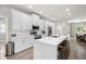 Contemporary kitchen featuring an island with bar seating, stainless steel appliances, and ample counter space at 5750 Carriage Dr, Sarasota, FL 34243