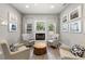 Cozy living room with a fireplace, complemented by neutral tones and inviting decor at 5750 Carriage Dr, Sarasota, FL 34243