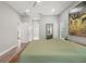 Neutral-toned main bedroom with stylish accents and wood-look floors at 5750 Carriage Dr, Sarasota, FL 34243