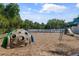 A community playground area with slides, climbing dome and swings at 5750 Carriage Dr, Sarasota, FL 34243