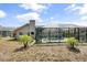 This home's enclosed pool area boasts sunny skies and desert landscaping, perfect for outdoor relaxation at 5750 Carriage Dr, Sarasota, FL 34243